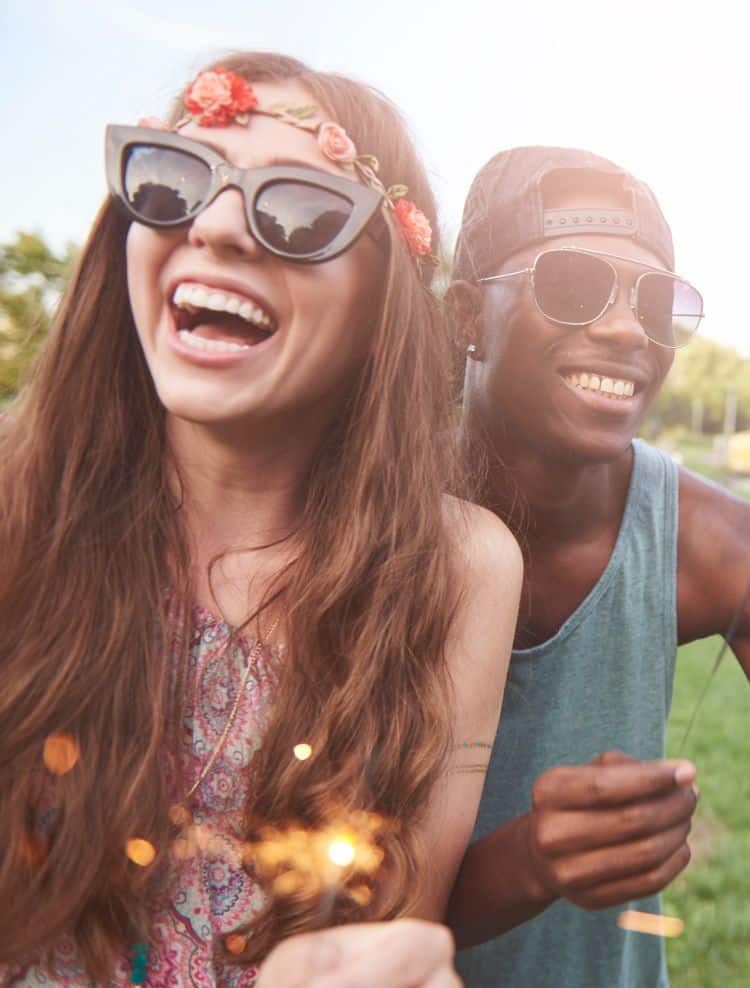Young and happy people with sparklers