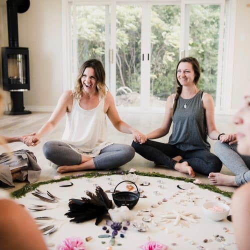 Women around circle in yoga retreat<br />
