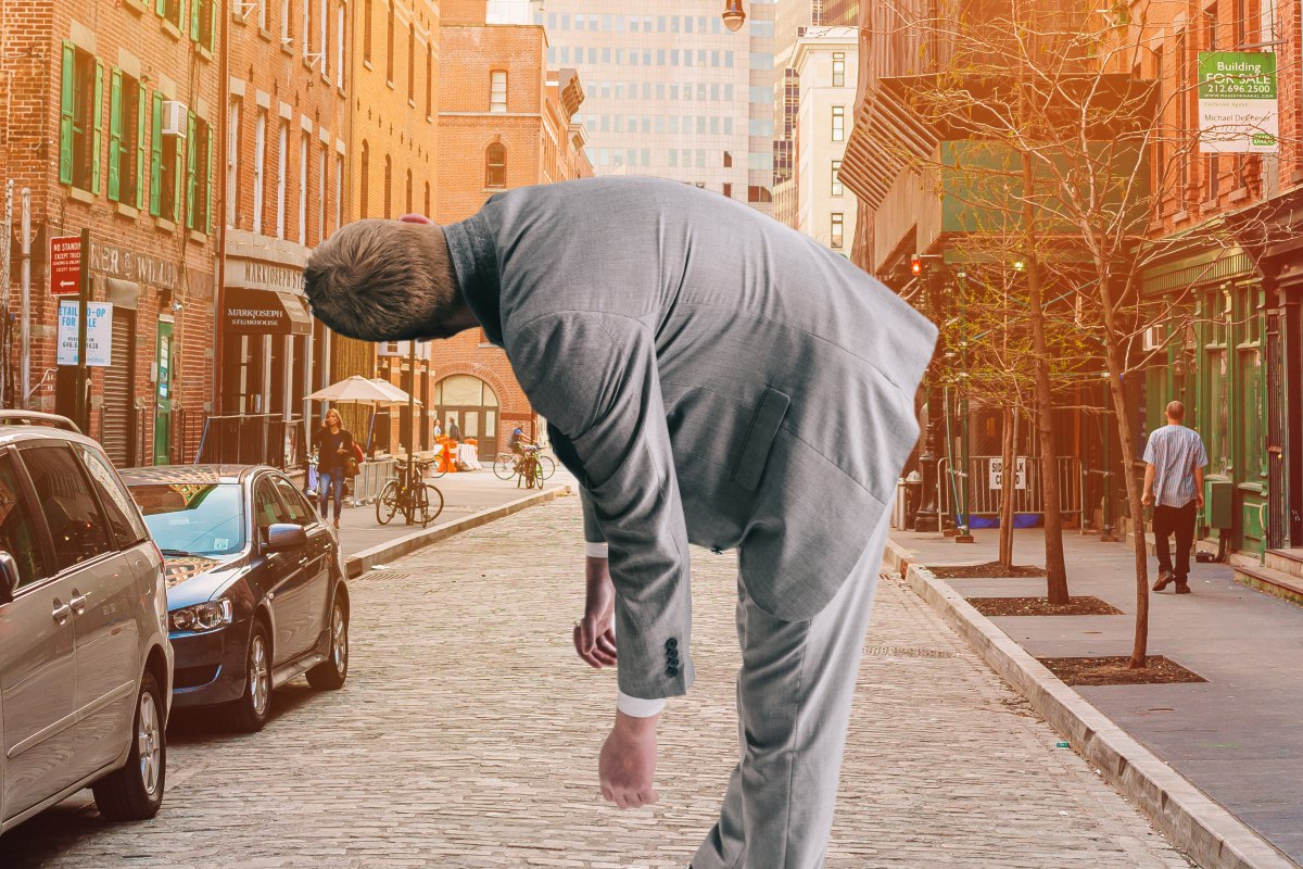 man bent over in fentanyl fold in city streets